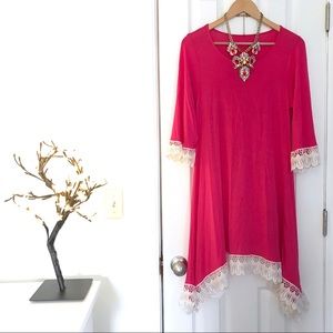 Hot pink bell-sleeved dress with eyelet trim